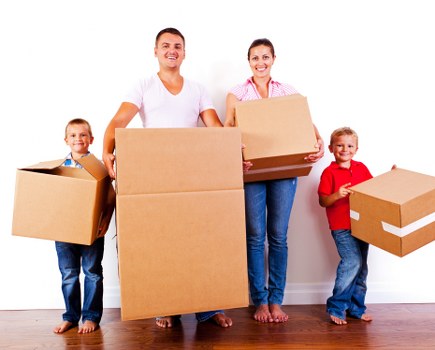 House removalists loading household items into a moving truck