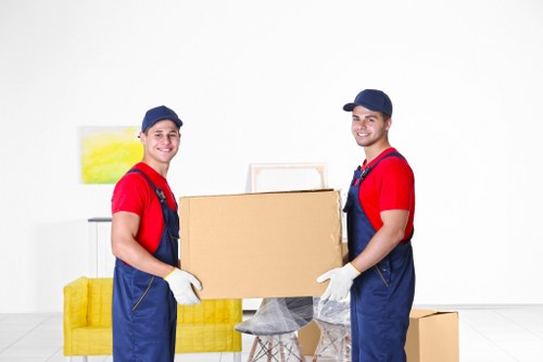 Local removal team planning a move in Queensbury with boxes and furniture