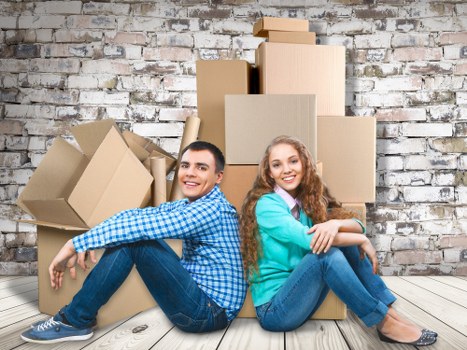 Professional flat removals in Queensbury with boxes and moving van