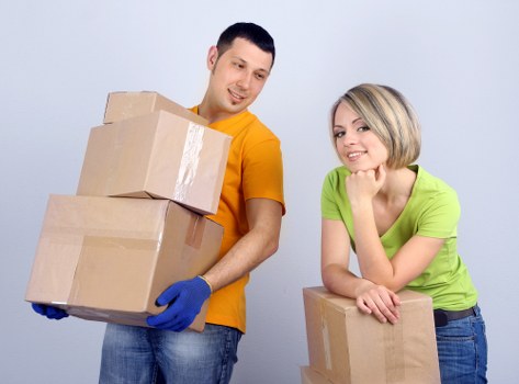 Packed boxes and furniture ready for removal services in Queensbury